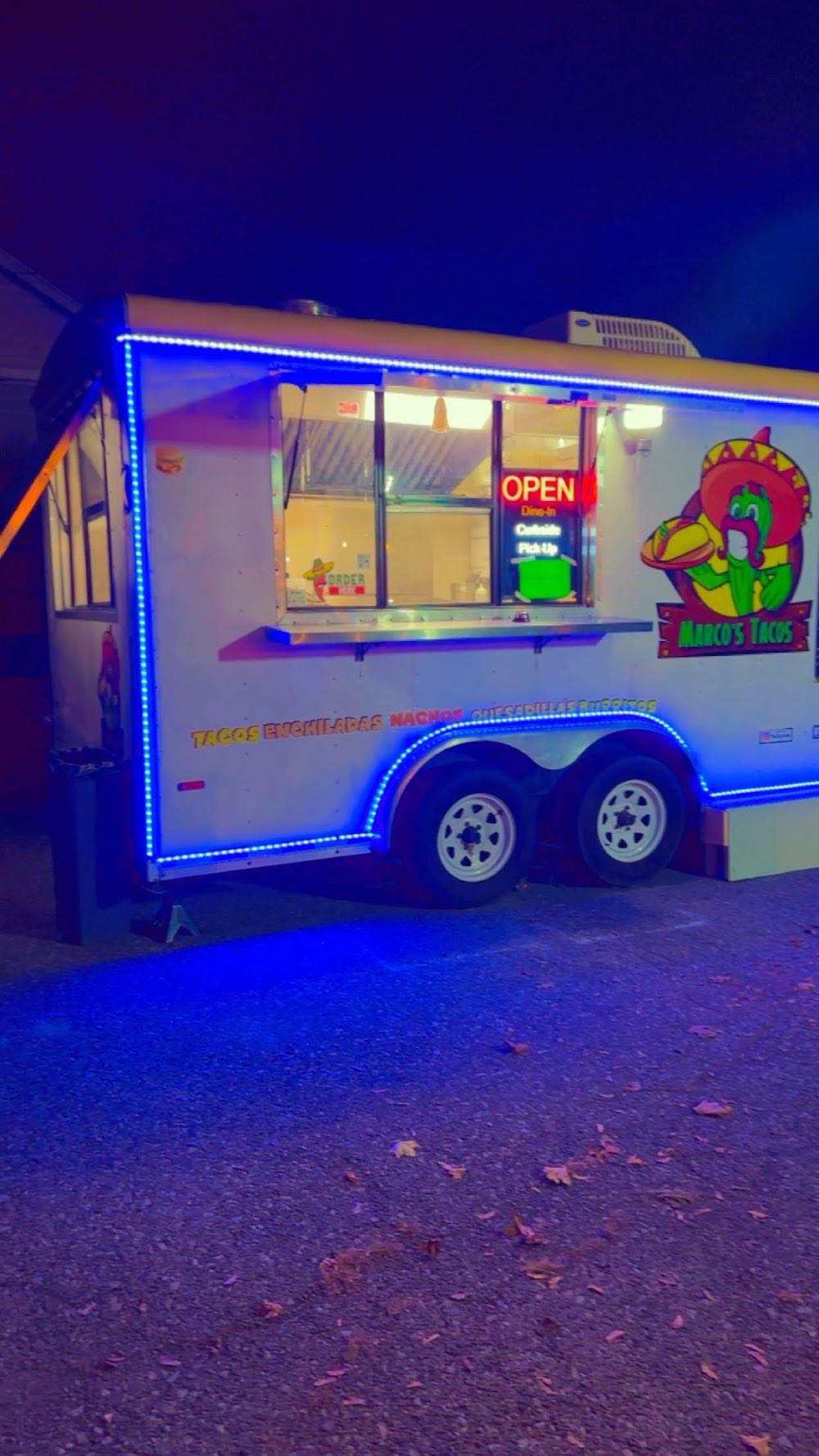 Marco's Tacos food truck lit up at night with blue LED accents